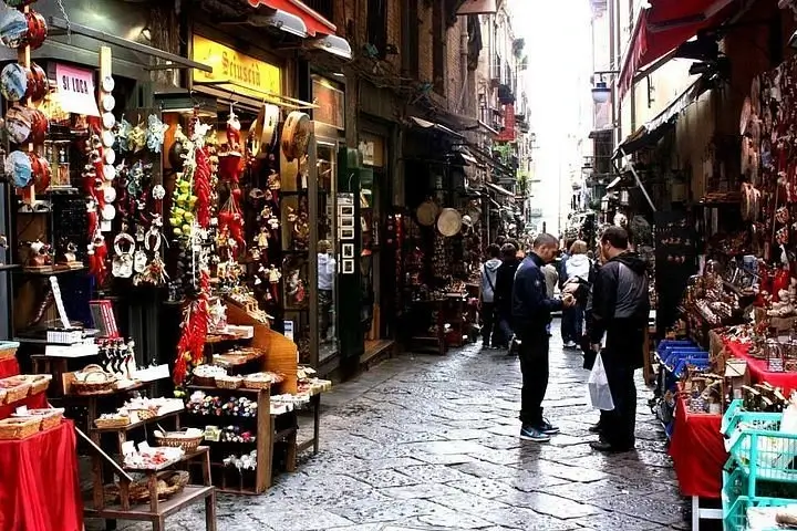 Narrow shopping street market in Naples with local vendors